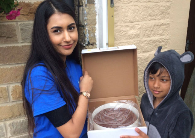 Children delivering chocolate fudge cakes during Ramadan.