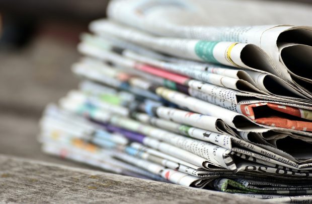 A large stack of newspapers.